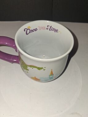 Disney Parks ceramic coffee mug featuring iconic castles from classic fairy tale